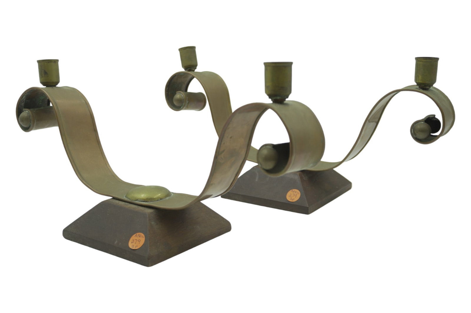 PAIR OF HECTOR AGUILAR TAXCO, MEXICO, COPPER & BRASS CANDELABRAS: Modernist copper and brass two light candelabra, Hector Aguilar (Mexican, 1905-1986), Taxco, Mexico, mid 20th c., each on wood base. Measures 7 1/2" x 12 1/4" x 5 1/2". Total Weight 4 lbs.