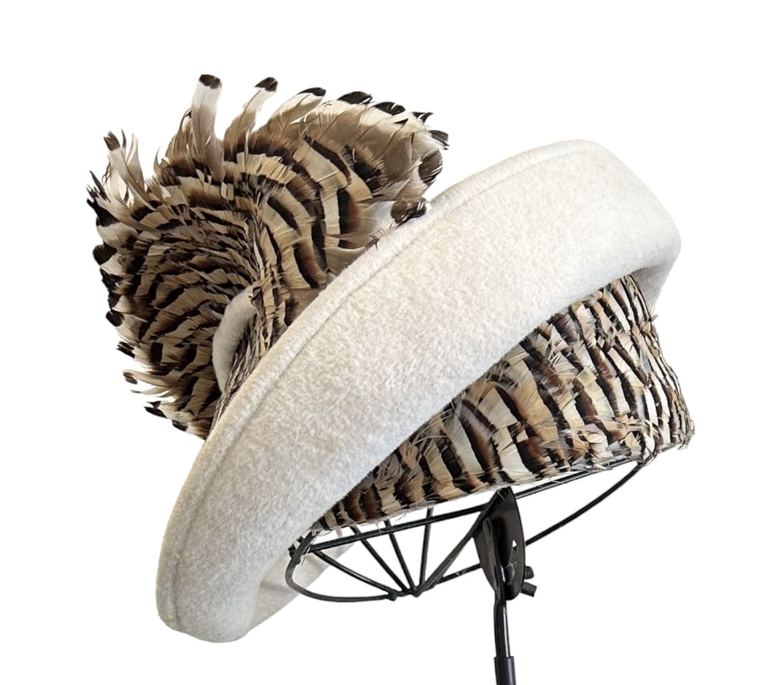 VINTAGE JACK MCCONNELL WOOL & PHEASANT HAT: This is an absolutely stunning vintage hat by the famous 1940's-60's hat designer, Jack McConnell. The hat features a winter white wool exterior and simply gorgeous pheasant feather trim around the in