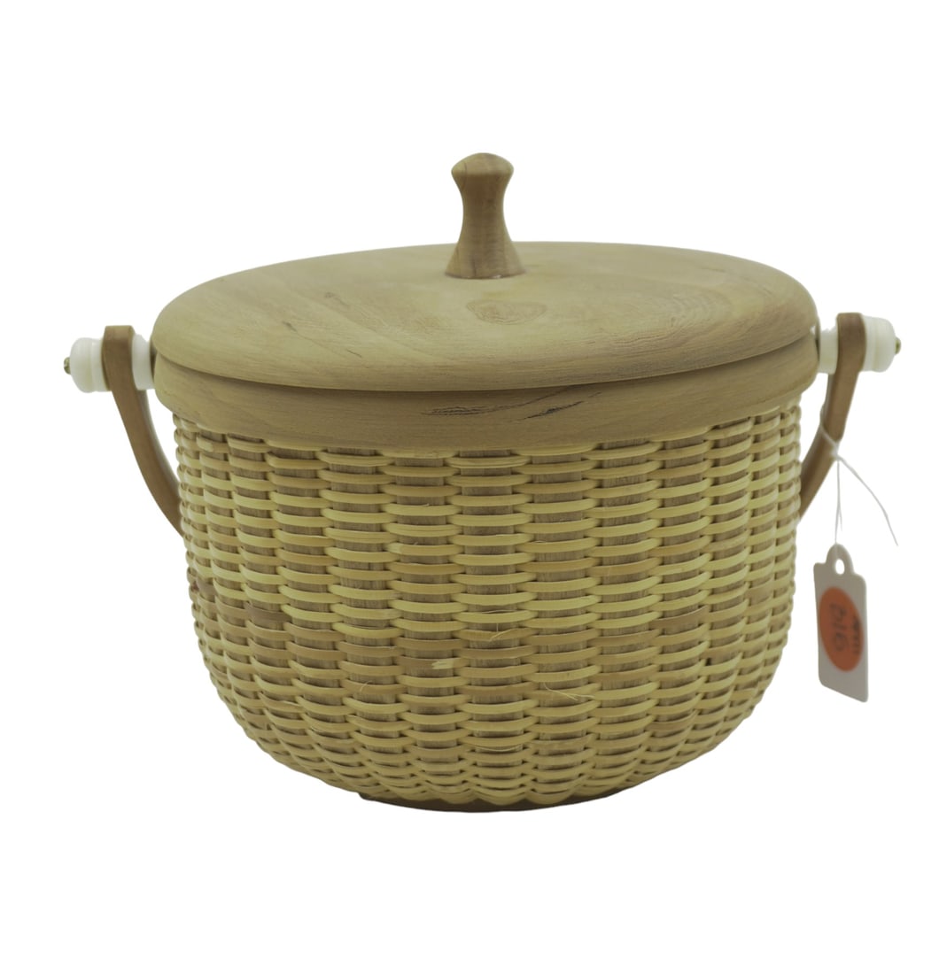 VINTAGE HANDMADE NANTUCKET BASKET: Vintage handmade nantucket basket with swivel handle and lid. Measures about 5.5 in diameter and 6.25" in height. Weighs 7.3 oz.