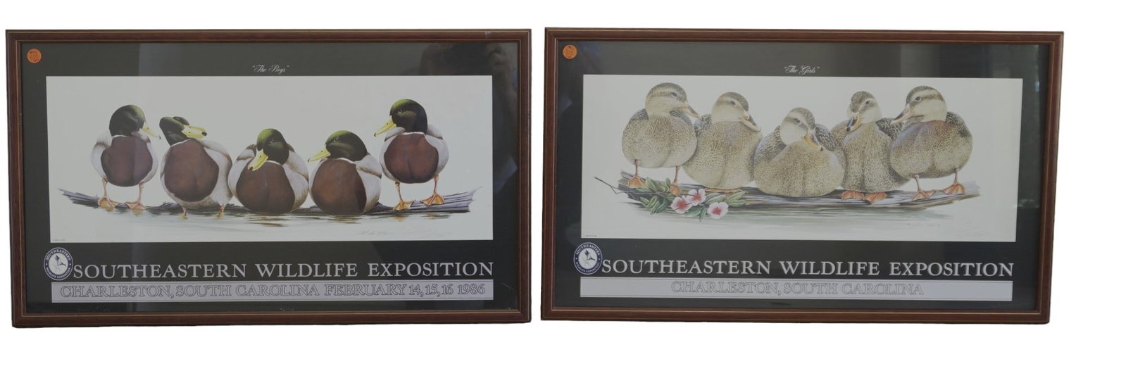PAIR 1986 SIGNED ART LA MAY "THE BOYS" AND "THE GIRLS" SEWE EXPO POSTERS: Pair of 1986 Southeastern Wildlife Expo posters of art titled "The Boys" and "The Girls" by artist Art La May. Each one is signed and inscribed by the artist and in custom framing with glass. Each mea
