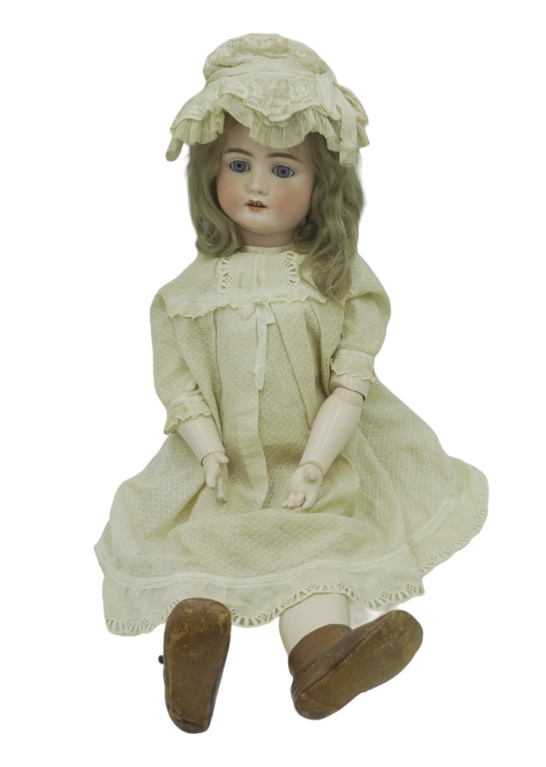 ANTIQUE GERMAN K.H. DOLL 27": This is a 27" antique German bisque head doll. Marked K.H.Germany to back of head. Mohair wig. Blue glass sleep eyes. Open mouth with 4 teeth. Jointed composition body. antique clothes and leather sho