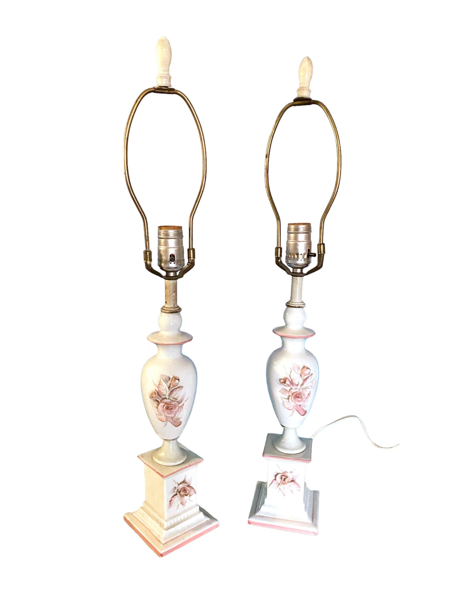 Pair of 1940’s Porcelain Pink Rose Lamps: White lamps with raised delicate pink roses and pink details throughout. Original finials. They have been rewired. Excellent vintage condition with no chips or cracks. Lamp shade not included. Measure