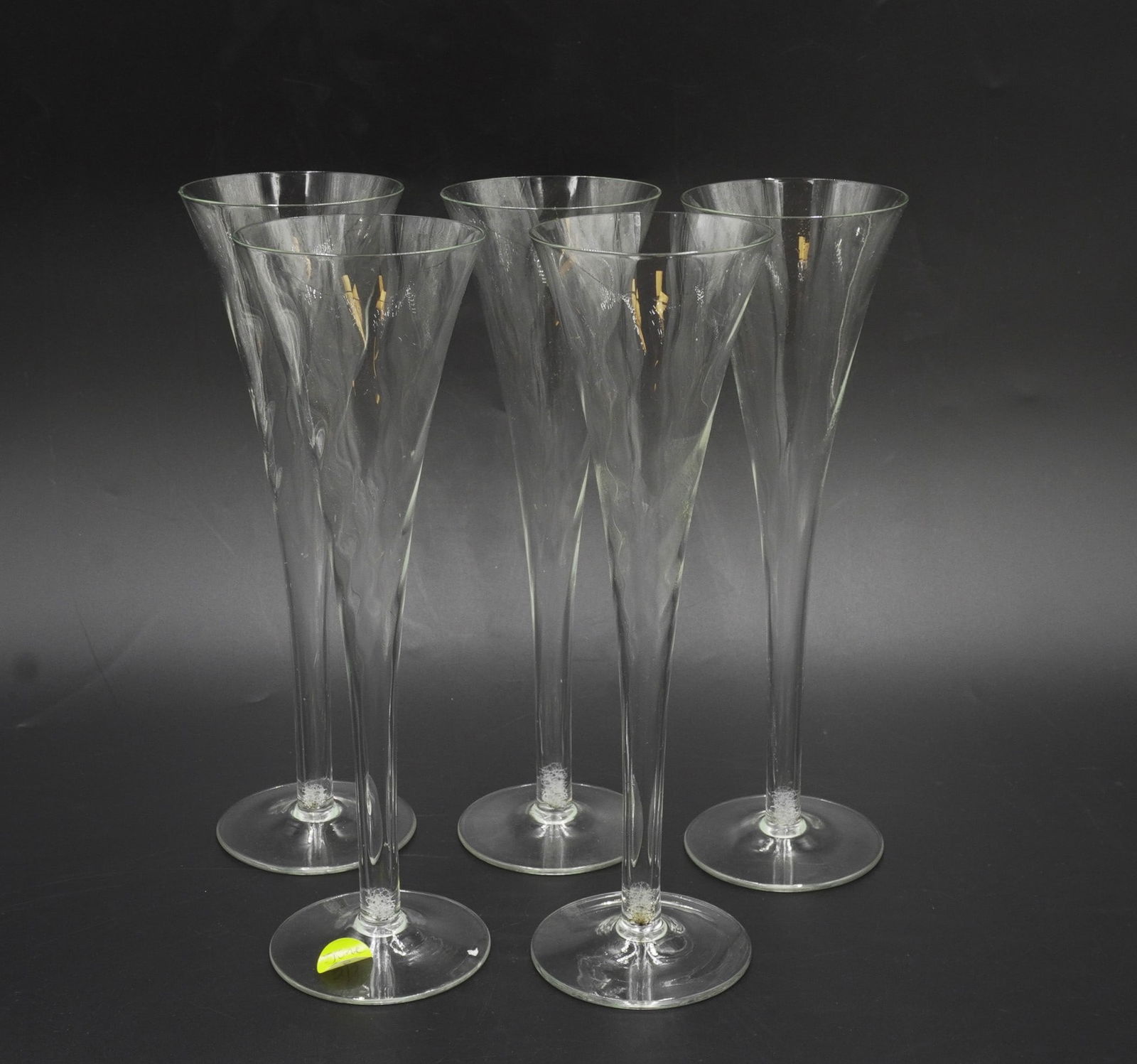 5 TALL FLUTED BLOWN GLASS CHAMPAGNES: Five Fluted Blown Glass Champagnes in the Perignon Pattern by Toscany. Each 9 7/8". Weight on all 1 lb 3 oz. PROVENANCE: The Charles Drayton House, 25 E. Battery, Charleston, SC