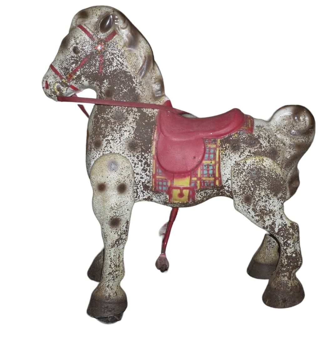 VINTAGE MOBO STEEL CHILDRENS RIDING HORSE ALL ORIGINAL: Vintage 1940s English Mobo Bronco Metal Horse by D. Sebel Childrens Riding Toy. Rolls on wheels when foot pedals are pushed down. It is about 30? tall. There is rust as seen in photos. he Mobo Bronco 