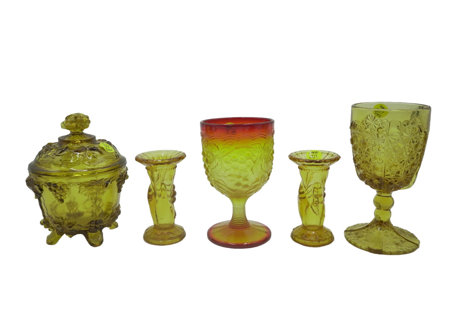 5 PIECES VINTAGE AMBER GLASS: 5 pieces of Vintage Amber Glass. This lot includes 1) 2 Embossed Hand Torch Bud Vases or Candle Stick Holders, measure 4" tall. 2) LG Wright Amber Daisy and Button Wine Glass, measures 6.25" tall and 