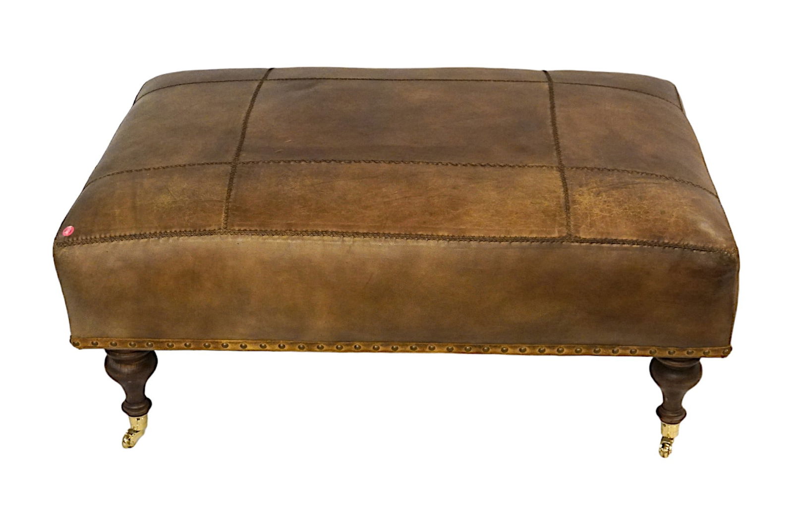 HANCOCK & MOORE LEATHER OTTOMAN / BENCH: Hancock and Moore Mahogany and Leather Ottoman on Wheels. Good condition. Measures 27"x39"x18". PROVENANCE: A Daniel Island Private Estate