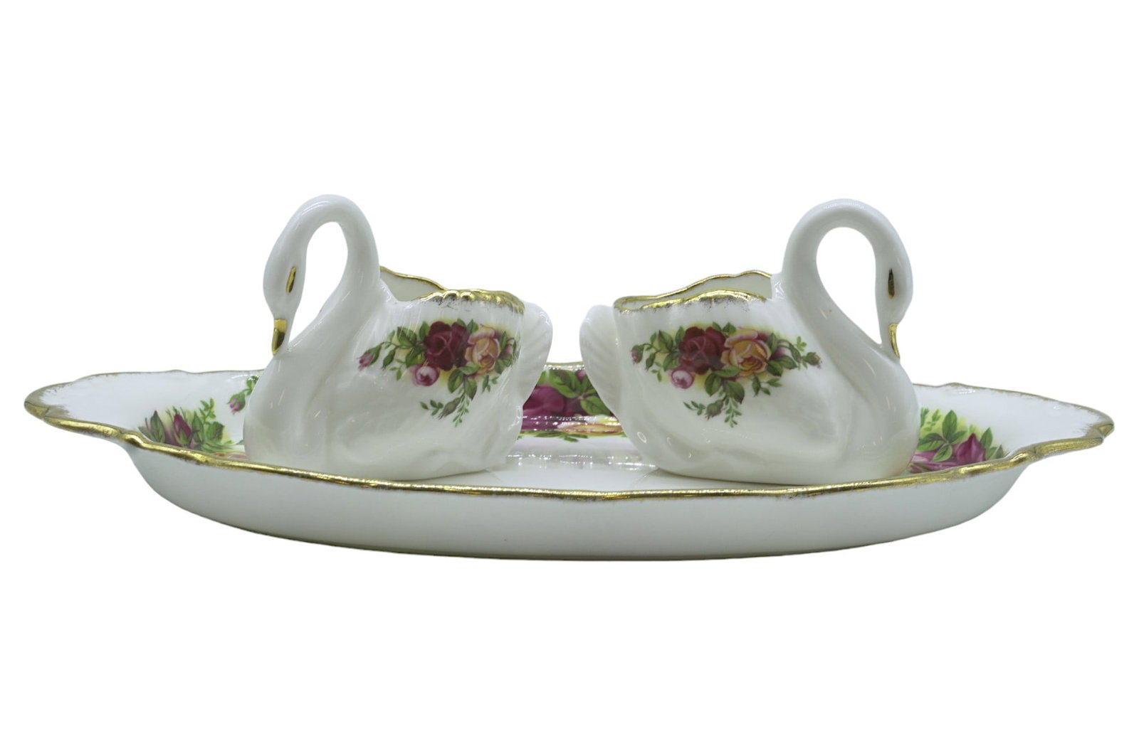 OLD COUNTRY ROSES ROYAL ALBERT BONE CHINA SET - 3 PIECES: Old Country Roses Royal Albert Bone China England, 1962. All pieces marked on bottom. This lot includes 1) Two Swans, each measure about 2.75" x 3" x 1.75" 2) Dish/Tray, measures 10" x 6", total lot w
