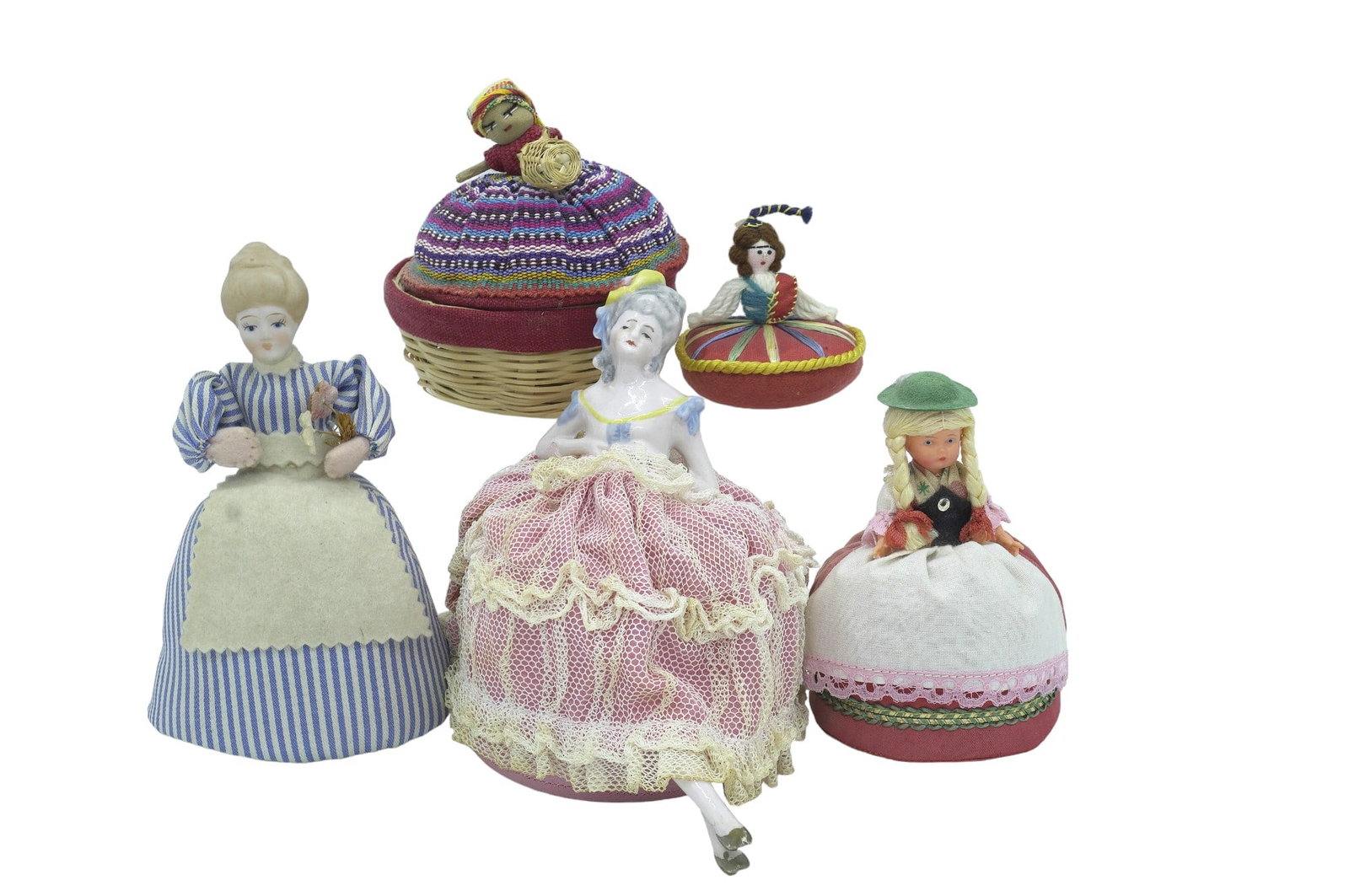 VINTAGE INTERNATIONAL PIN CUSHIONS - 5 Pieces: 5 Vintage Pin Cushions from Spain, Germany, Switzerland, and Guatemala. Largest measures 6" x 6.75" x 4", total lot weight is 1 lb.