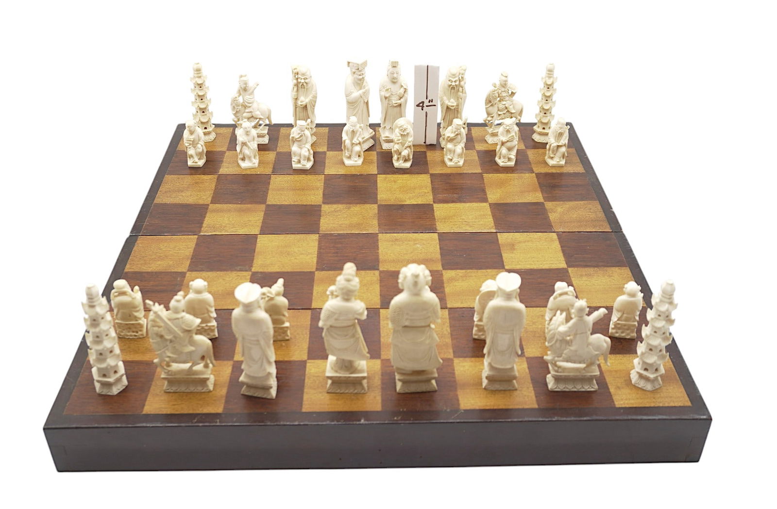 VINTAGE CHINESE FINELY CARVED BONE CHESS SET: Vintage Chinese Finely Carved Chess Set. Complete. With wood chess board box. Tallest piece is 4". Box measures Pieces very good, inside box missing lining 1 side. Box 18"x9"x3.5". Weight 4 lbs 6 oz.