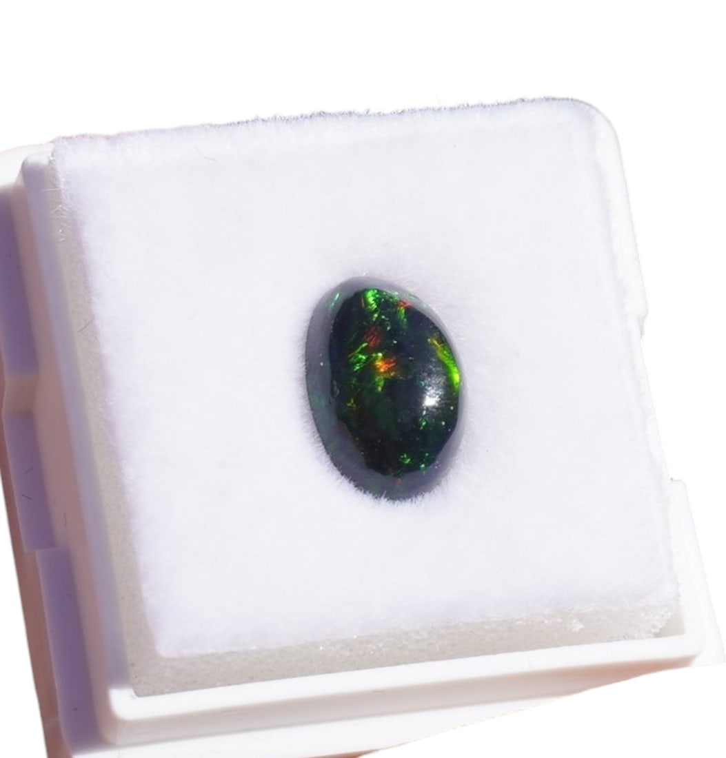 OVAL ETHIOPIAN BLACK FIRE OPAL 3.74 cts: 3.74 Ct Natural Ethiopian Black Fire Opal Oval Cab. Measuring approximately 18.39mmx12.57mm, approximately 3.74 carats.