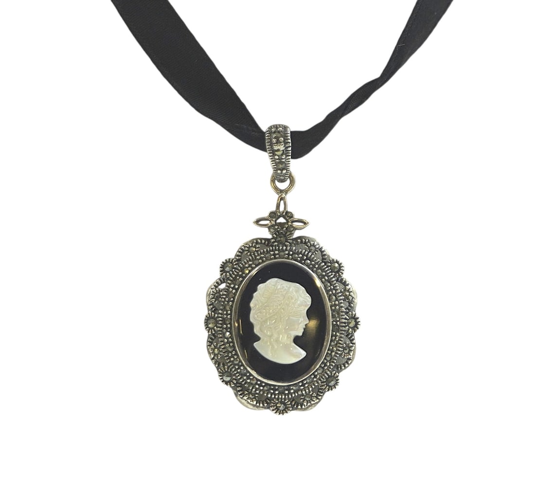 STERLING MARCASITE ONYX MOP CAMEO: Vintage Sterling Silver Marcasite Onyx MOP Cameo on Black Silk Ribbon. Cameo 1.5". Weight 8 grams.