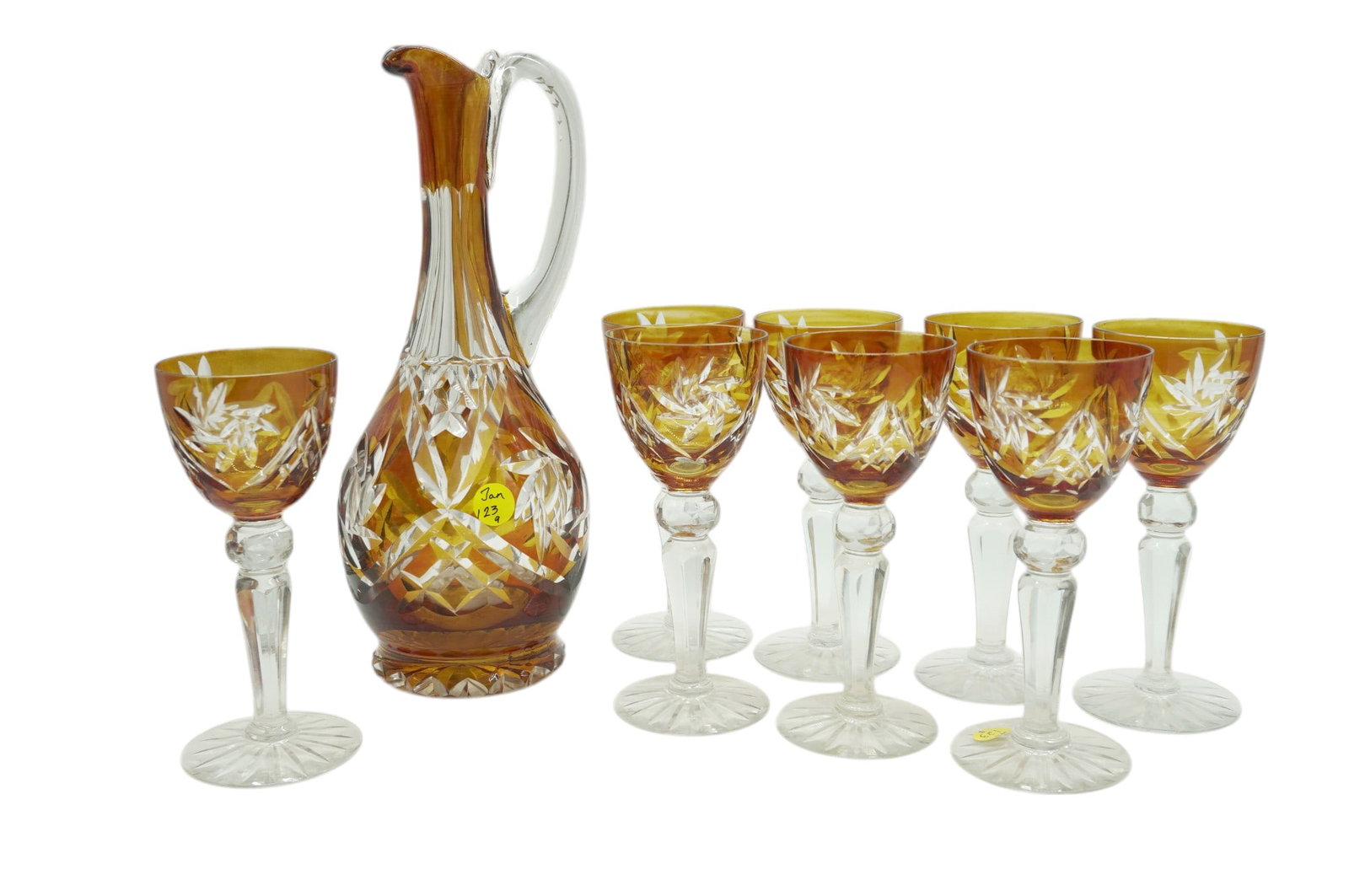 SET BOHEMIAN AMBER CUT TO CLEAR DECANTER & 8 WINES: Vintage Bohemian Good Quality Amber Cut To Clear Wine Decanter and Eight (8) Wine Glasses. Decanter 4.5"x12". Glasses 2.75"x6.75". Weight on all combined 7 lbs 6 oz.