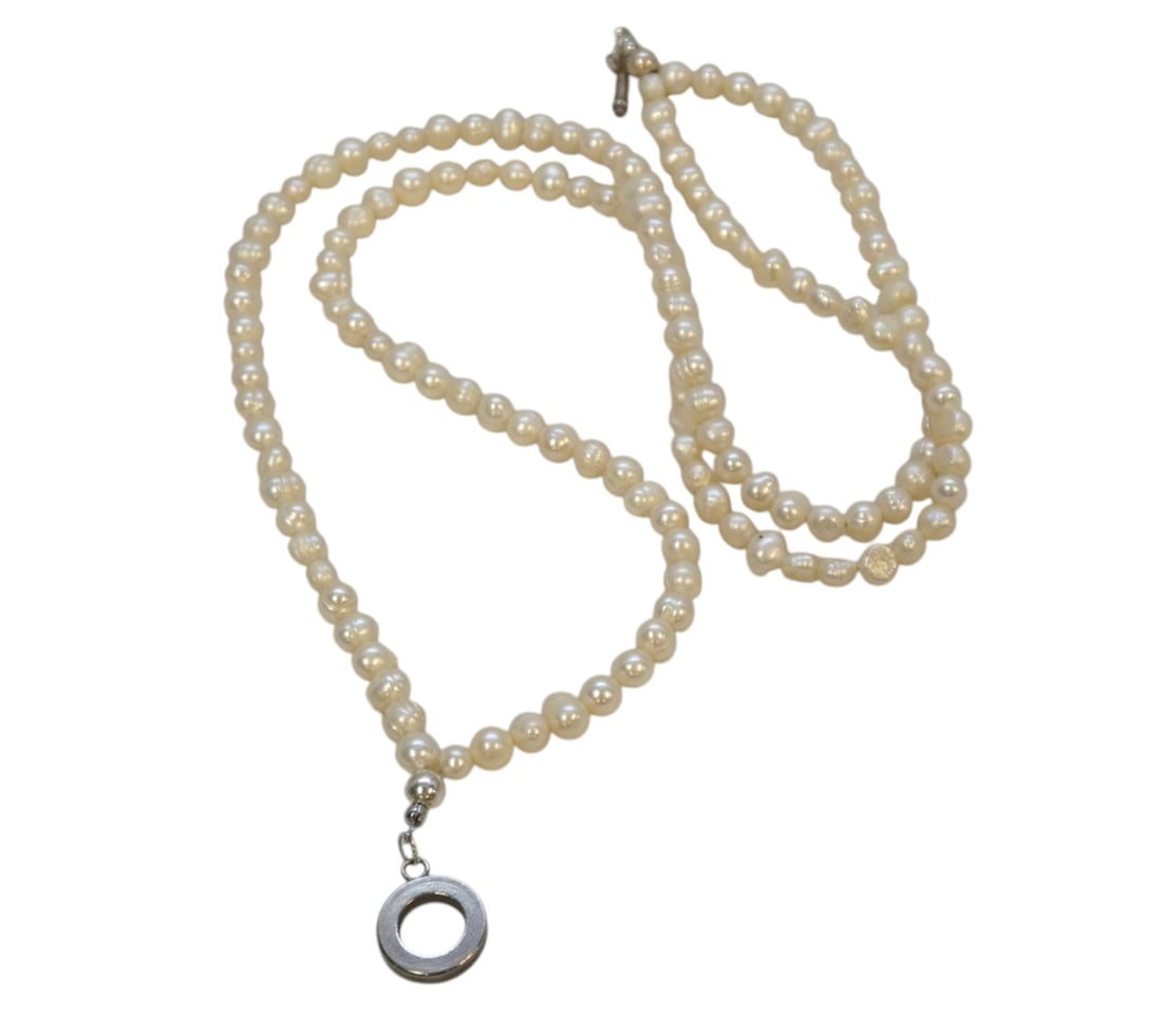 DOUBLE STRAND FRESHWATER PEARL NECKLACE: Double Strand Freshwater Pearl Necklace. Measures 18" open. Weight 2 oz