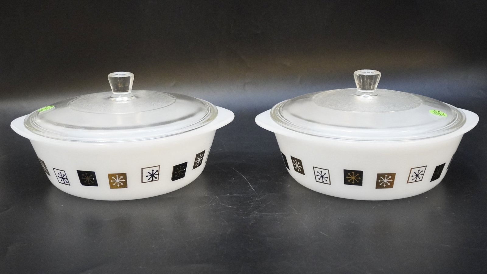 PAIR VINTAGE INLAND GLASS ATOMIC MCM COVERED CASSEROLE DISHES: Pair Vintage Inland Glass Atomic MCM Covered Casserole Dishes. Each measures 5.25" x 10" x 8.5", total lot weight is 6 lbs.