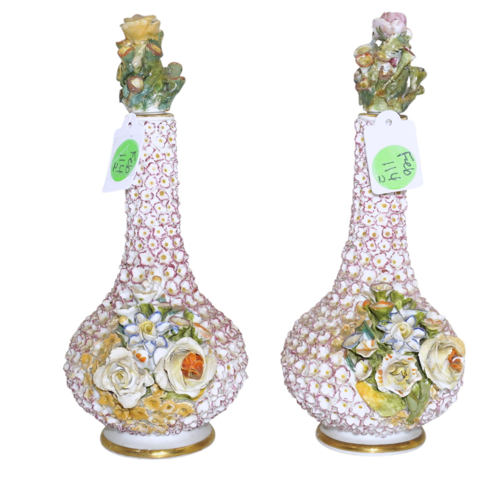 PAIR OF JACOB PETIT PORCELAIN PERFUME BOTTLES: This exquisite pair of porcelain "snowball" perfume bottles are the work of renowned French porcelain artist Jacob Petit. Taking their inspiration from the exquisite Schneeballen vases made by Meissen