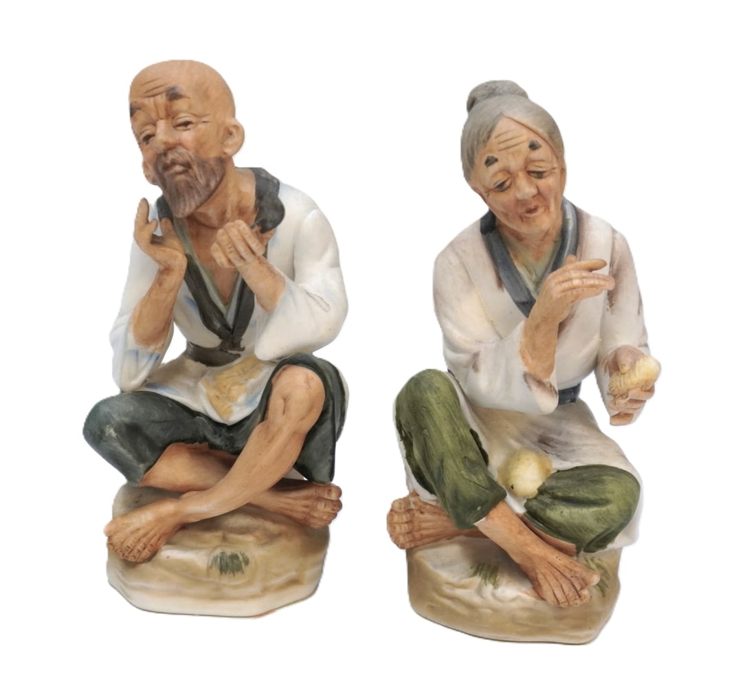 JAPANESE BISQUE PORCELAIN OLD MAN AND WOMAN FIGURINES: Japanese Bisque Porcelain Old Man and Woman Figurines. Each measures about 6.25" x 3.5" x 3.25", total lot weight is 1 lb 2 oz.