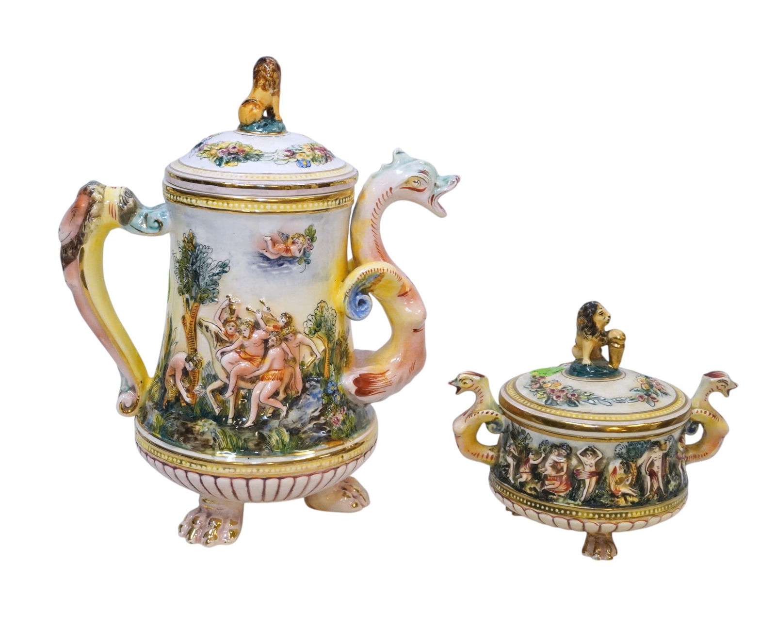 2 PC VINTAGE ITALIAN CAPODIMONTE COFFEE POT & SUGAR: Vintage Italian Capodimonte Footed Coffee / Tea Pot and Covered Sugar. Dragon Spout, Lion Finials. Pot 8"x5 1/2"x10". Sugar 6"x4"x5". Weight combined 3 lbs