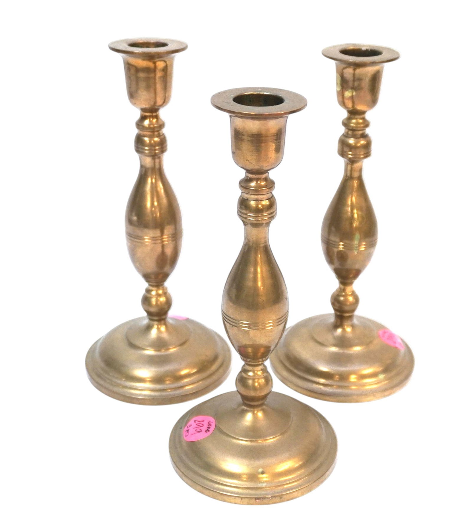 3 VINTAGE BRASS CANDLESTICKS: 3 Vintage Brass Candlesticks. Each measures about 8" tall and 3.75" in dia.