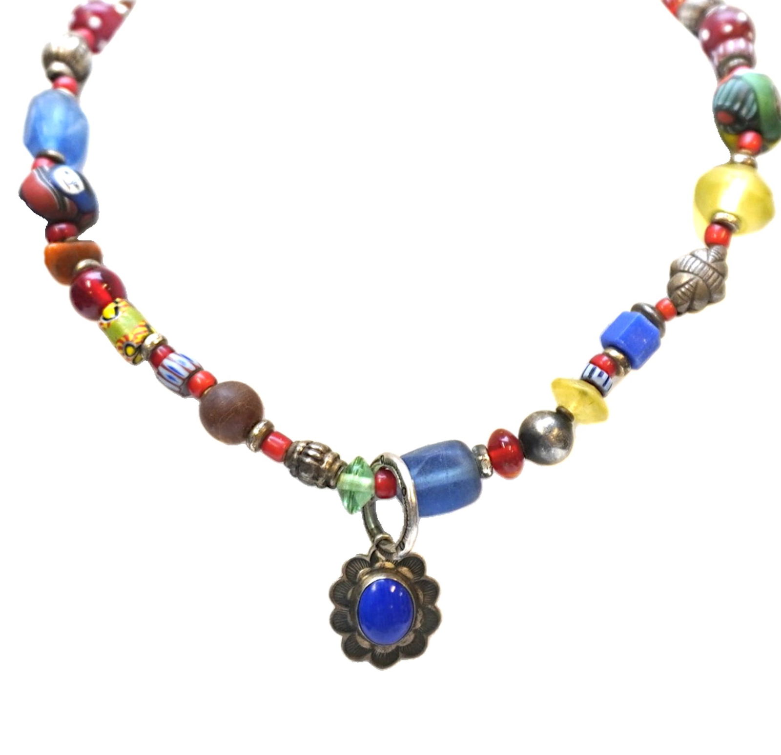 TRIBAL BEADS AND STERLING LAPIS PENDANT NECKLACE: Vintage Tribal Beads, clay and glass with silver spacers and a signed Don Lucas Sterling Lapis Lazuli Pendant. Don Lucas of Bakersfield, California offers a variety of fine jewelry made with turquoise