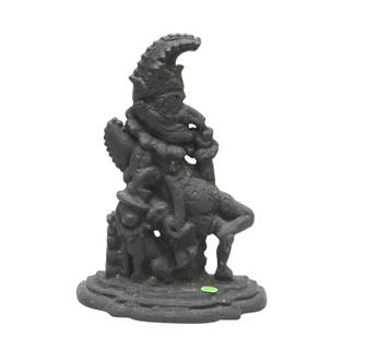 ANTIQUE CAST IRON COURT JESTER WITH DOG DOORSTOP: Antique Cast Iron Court Jester with Dog Doorstop. Measures 12" x 9" x 3.5" and weighs 6 lbs 12 oz. Provenance: Gippy Plantation, Avenue of Oaks, Berkeley County, South Carolina