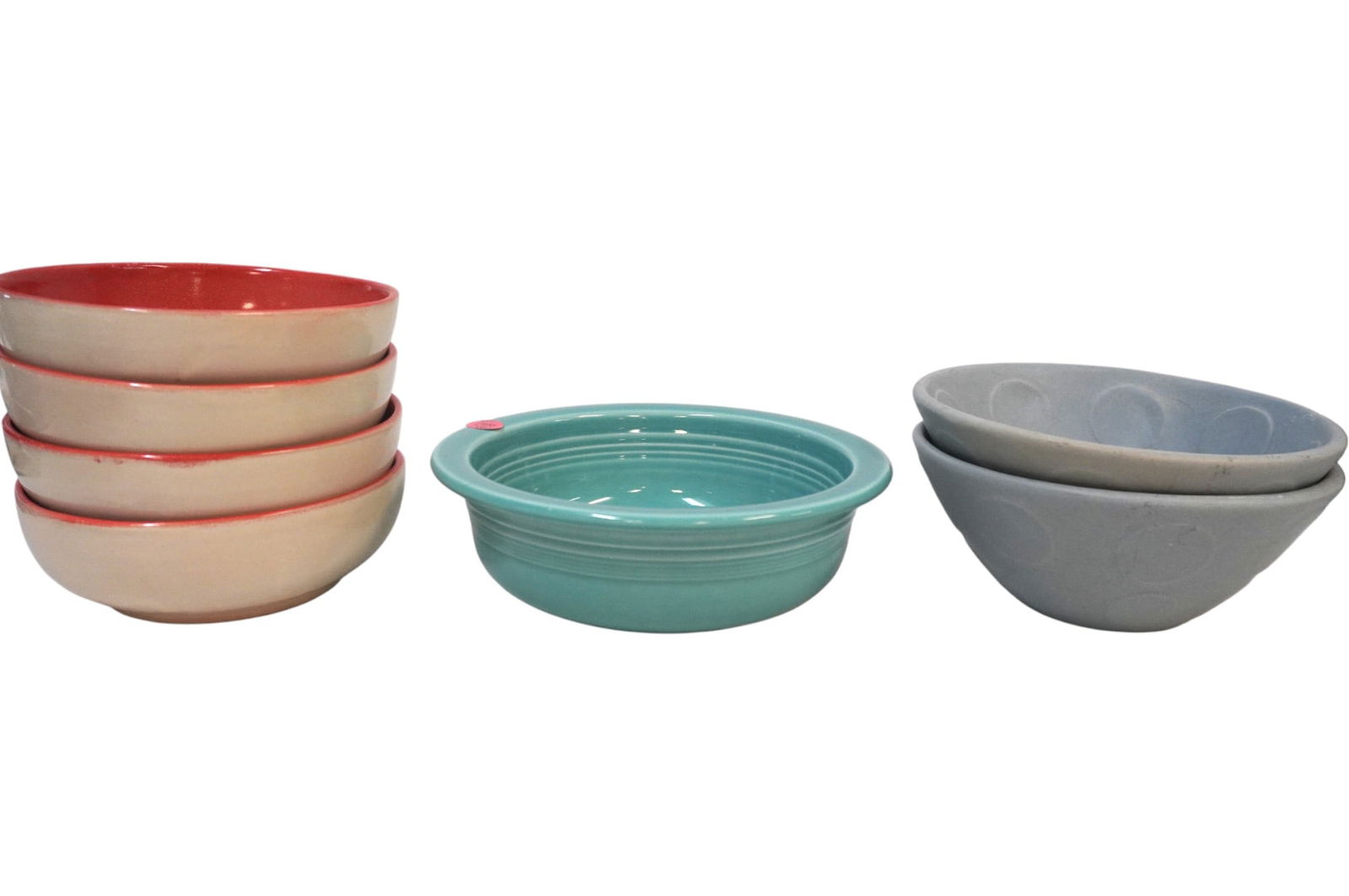 7 POTTERY BOWLS - FIESTA, JONATHAN ADLER, AND GOGO GTO MEX: This lot includes 1) 4 Gogo GTO Mexico Red and Cream Bowls which measure 2.25" x 6.75" 2) 2 Blue Jonathan Adler Pot A Porter Bowls which measure 3" x 7.25" 3) 1 Turquoise Fiesta Cereal Bowl which meas