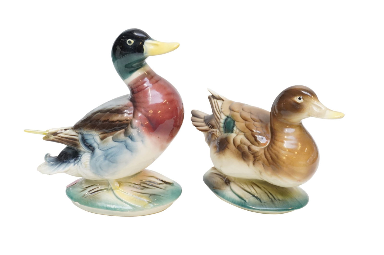 PAIR OF MID CENTURY ANTHONY PRIOLO FOR ROYAL COPLEY MALLARD DUCKS: Pair Royal Copley Pottery Ducks marked AD Priolo (Artist Anthony D. Priolo) from the Game Birds of America series produced in the 1950s. 8"x4"x9.25" and 9 1/2"x4"x6 1/2". Weight combined 3 lbs
