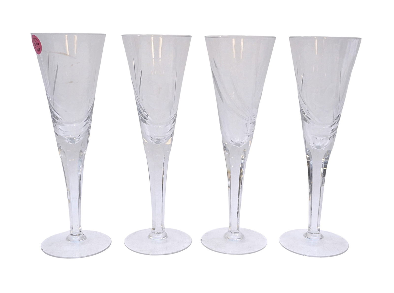 4 CUT & ETCHED CRYSTAL CHAMPAGNE FLUTES: 4 Cut and Etched Crystal Champagne Flutes. Each 2.75"x8.75". Weight on all 2 lbs. Nick to 1 foot. PROVENANCE: A Rainbow Row, Charleston SC, Private Estate