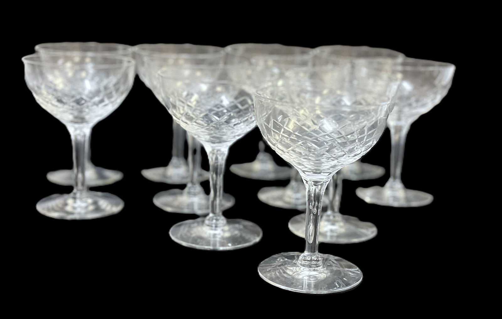 11 VINTAGE CRYSTAL CHAMPAGNE GLASSES: 11 Vintage Crystal Champagne Glasses. Each measure 5" x 3.75" dia., total lot weight is 3 lbs 12 oz.