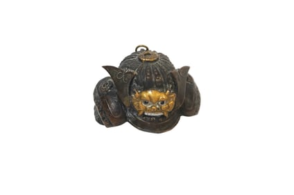 A MINIATURE BRONZE MODEL OF A KABUTO