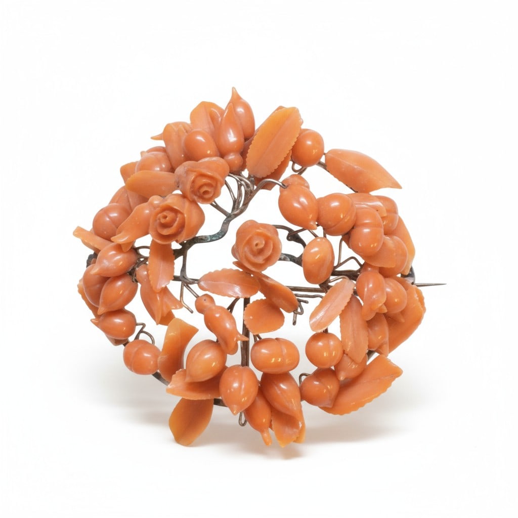 ORNATE ANTIQUE CORAL BROOCH: Ornate handwired carved antique coral brooch. Likely 1860s/70s, Europe. Beautiful Natural Orange Salmon Coral, one of the rarest to find. Measures about 2" and weighs 0.8 oz. PROVENANCE:The Historic 1