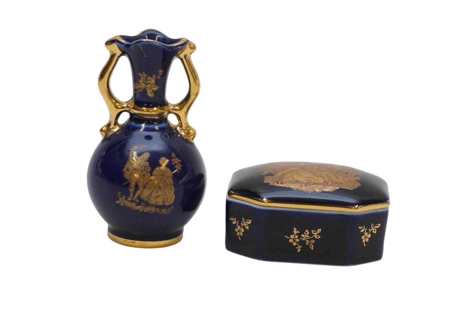 LIMOGES FRANCE TRINKET BOX AND SMALL VASE: Limoges France Trinket Box and Small Vase. Vase marked 18k on bottom and trinket box marked Limoges Castel 22k on bottom. Vase measures 3" x 1.5" in dia. and box measures 2.25" x 1.5" x 1", total lot
