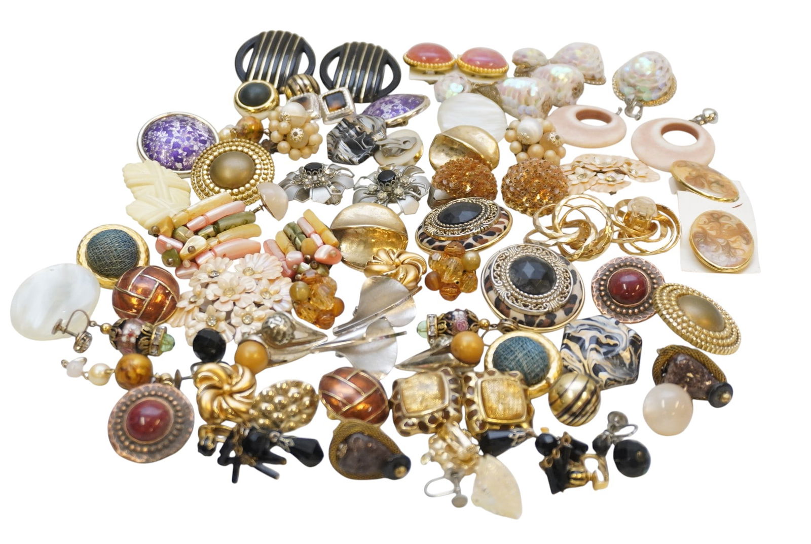 38 PAIRS OF VINTAGE CLIP-ON AND SCREWBACK EARRINGS: 38 Pairs of Vintage Clip on and Screwback Earrings in various designs/materials. Total lot weight is 1 lb 1.9 oz. PROVENANCE:The Historic 1798 John Burckmeyer House, 120 Wentworth Street, Charleston S