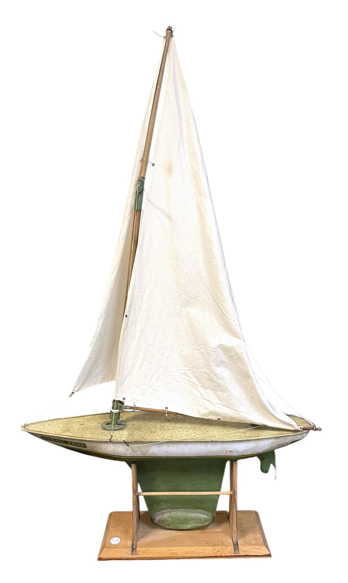 CHEIN 1930s PEGGY JANE POND SAILBOAT: Vintage 1930s Chein Peggy Jane Pond Sailboat. All original tin hull with wood and cloth sails and rigging. 41" tall 24 Long 6 wide. Weight 4 lbs. .Provenance: Gippy Plantation, Avenue of Oaks, Berkele