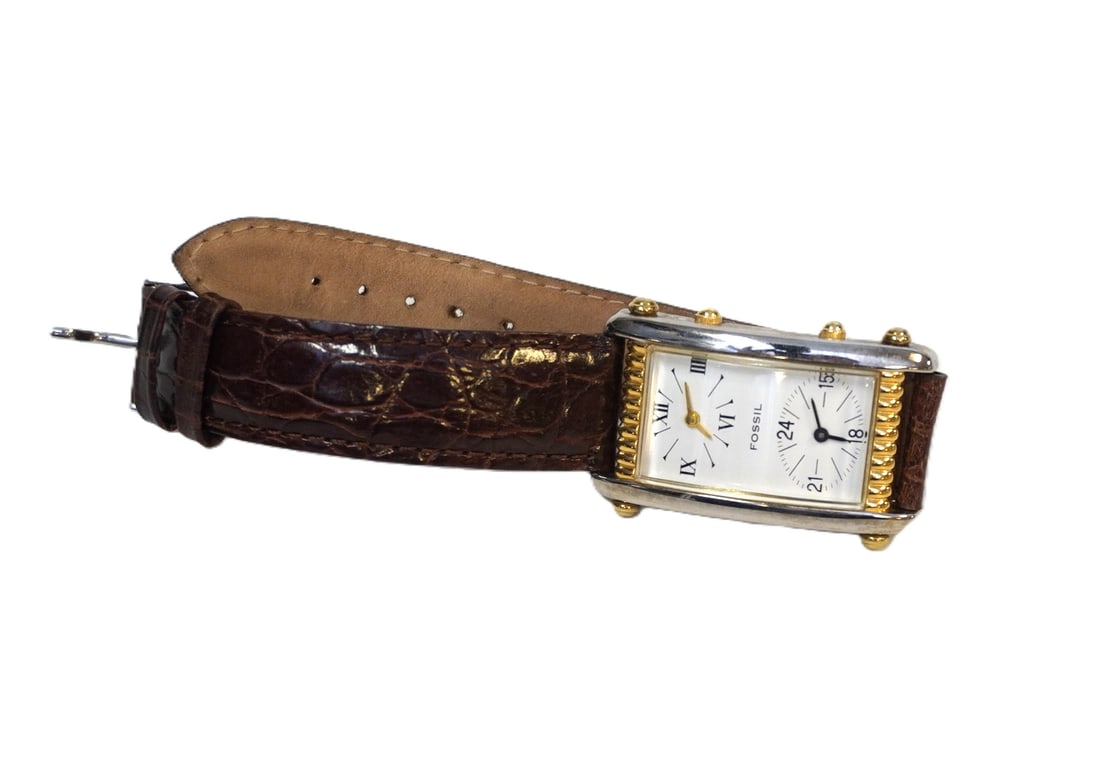 VINTAGE WOMEN'S FOSSIL LEATHER AND STEEL WATCH: Vintage Women's Fossil Leather and Stainless Steel Watch. Measures 9" and weighs 1.2 oz.