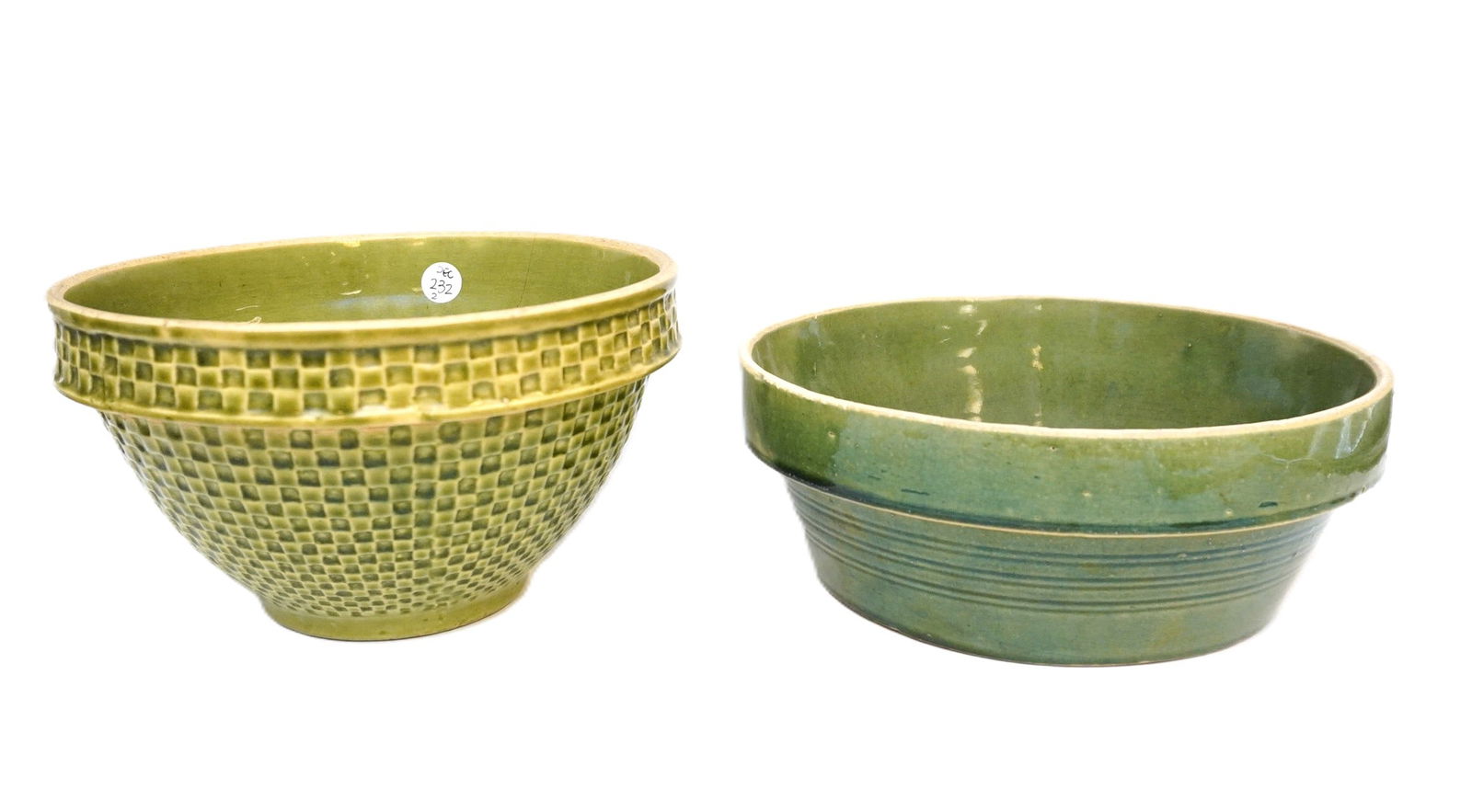 PAIR OF YELLOW WARE POTTERY BOWLS: Pair of Yellow Ware Pottery Bowls. Checkered measures 5.5" x 9.25" in dia. and shallow measures 3.75" x 10" in dia. Total lot weight is 5 lbs 14 oz.