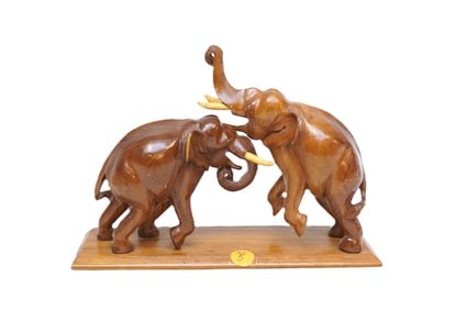 MID CENTURY HAND CARVED WOOD ELEPHANTS