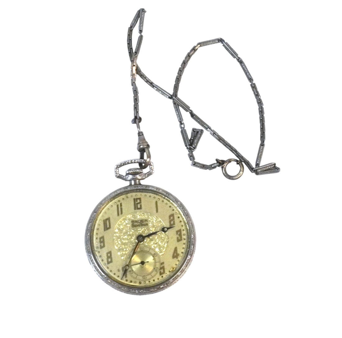 ART DECO GRUEN SEMI THIN 15J POCKET WATCH: Art Deco Era Gruen Semi Thin 15J Mechanical Pocket Watch & Fob. Watch runs. Watch 1 3/4"x1 3/4". Fob 14. Weight 2 oz. PROVENANCE:The Historic 1798 John Burckmeyer House, 120 Wentworth Street, Charlest