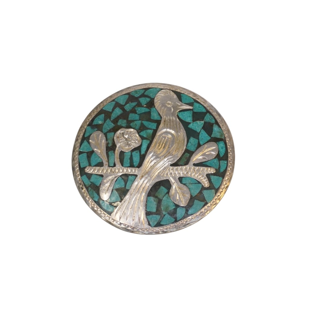 VINTAGE STERLING AND TURQUOISE QUETZAL MEXICAN BROOCH/PENDANT: Vintage Sterling and Turquoise Brooch/Pendant stamped 925 made in mexico. Features a quetzal bird. Can be worn as brooch or pendant. Measures 2" in dia, weighs 0.6 oz. PROVENANCE:The Historic 1798 Joh