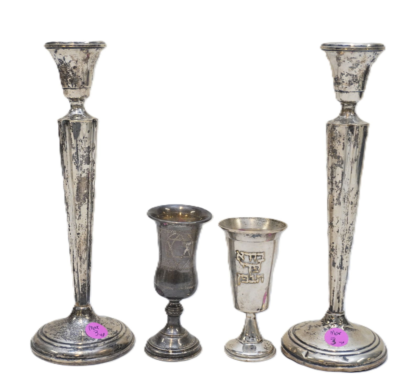 4 PC STERLING CANDLESTICKS, KIDDUSH CUPS: 2 Tall Sterling Weighted Candlesticks by Gaden Silversmiths 10". 2 Sterling Silver Kiddush Cups. Just Kiddush cups weight 104 grams. Weight including weighted candlesticks 2 lbs.Provenance: A Rainbow