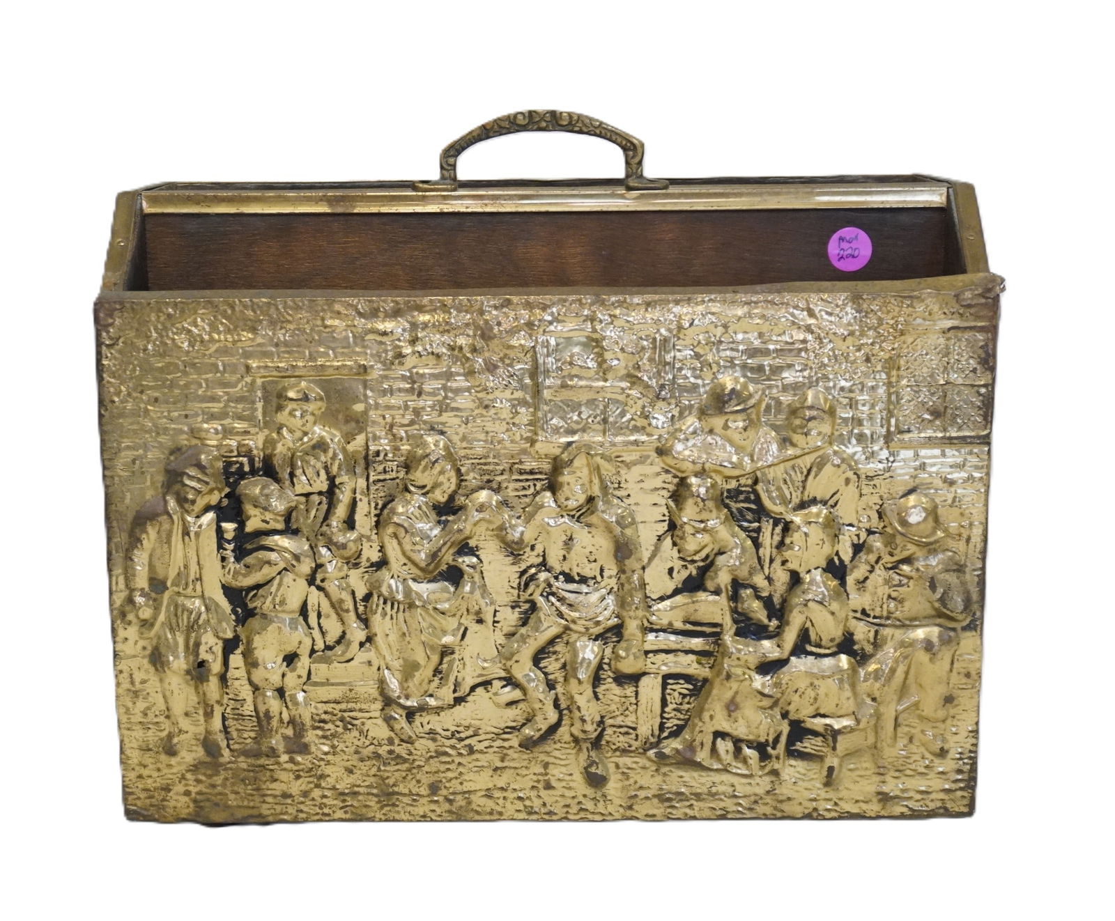 VINTAGE ENGLISH BRASS AND WOOD MAGAZINE RACK: Vintage English Embossed Brass Tavern Scene and Wood Magazine Rack. Measures 14 1/2"x7"x11 1/2". Weight 5 lbs 11 oz. PROVENANCE:The Historic 1798 John Burckmeyer House, 120 Wentworth Street,