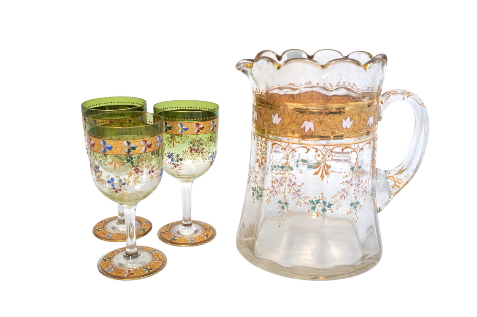 4 PC ANTIQUE BOHEMIAN ENAMELED GLASS PITCHER & GLASSES: 4 Piece Antique Bohemian Hand Painted Enameled Glass Pitcher & 3 Heavily Enameled Hand Painted Wine Glasses. Pitcher 7"x5"x7 1/2". Glasses each 5 1/4" Weight on all 4 lbs 2 oz. PROVENANCE:The
