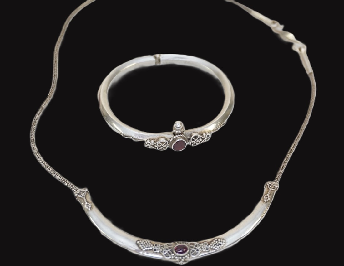 2 PC STERLING SILVER & GARNET NECKLACE & BRACELET: Ornate Sterling Silver & Garnet Cabochon Slide Necklace and Bangle Bracelet. Necklace 18" opened. Cuff 2 1/2" inside. Approximate silver weight 26 grams. **In house shipping available on this lot**