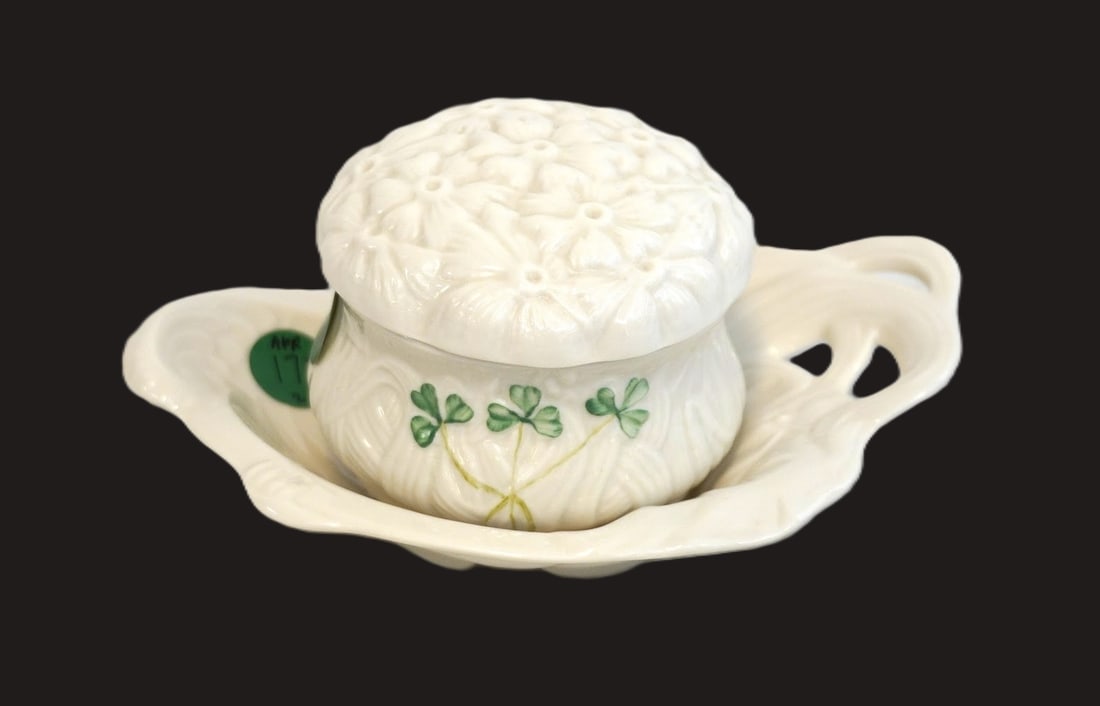 BELLEEK IRISH PORCELAIN SHAMROCK TRINKET DISH AND BOX: Belleek Irish Porcelain Shamrock Trinket Dish and Covered Box. Dish measures 6.5" x 4.5" x 1.5" and covered box is 2.5" x 3.25" dia. Total lot weight is 8.8 oz. **In house shipping available on this
