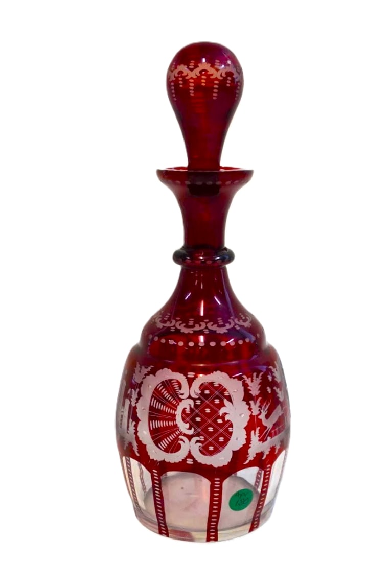 EGERMANN RUBY RED TALL BOHEMIAN DECANTER: Egermann Tall Ruby Red Decanter with intricate etched glass details including stag and hound. Measures 5"x5"x13 1/4". Weight 3 lbs 8 oz. **In house shipping available on this lot** If you win this lot