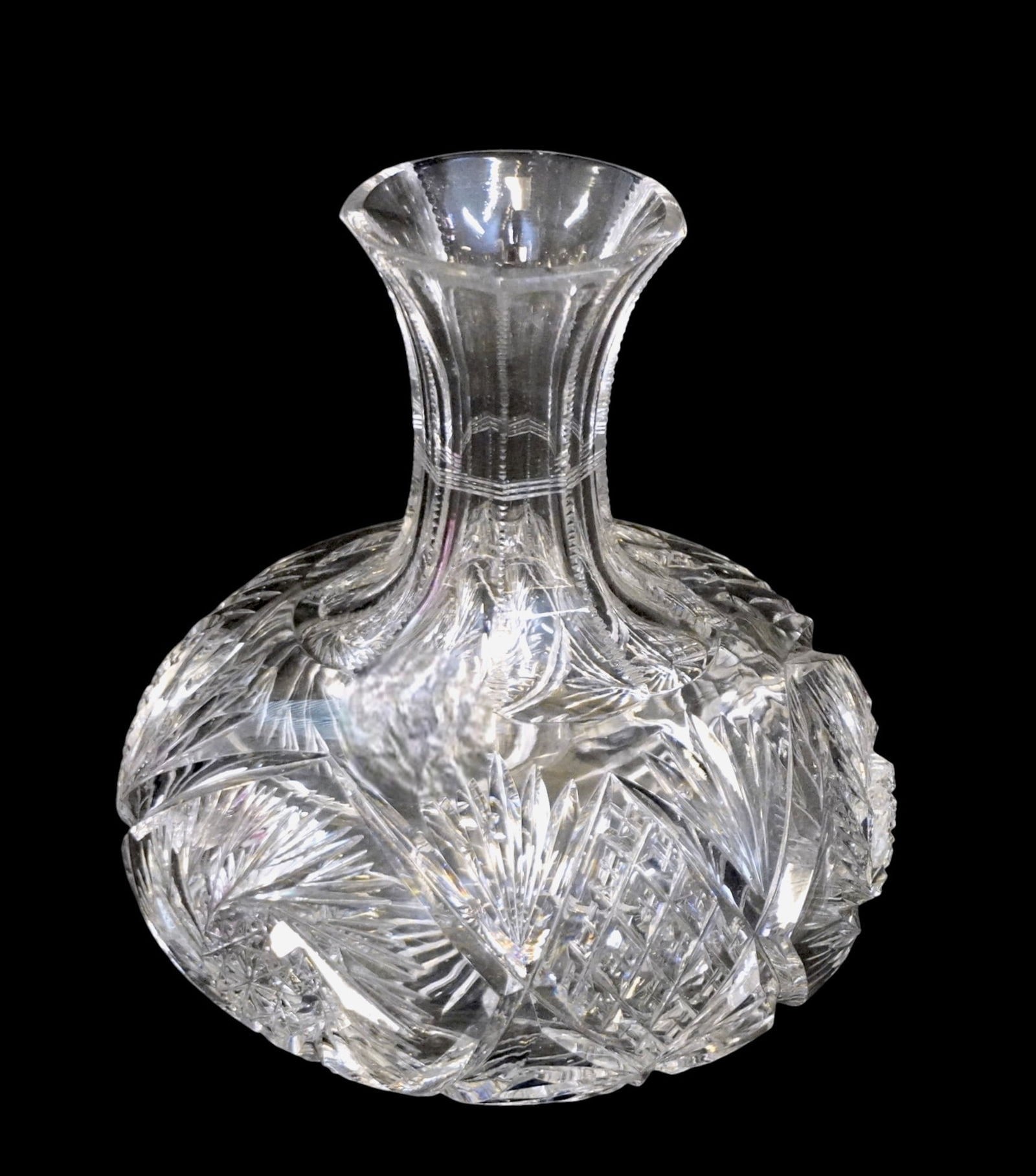 AMERICAN BRILLIANT CUT GLASS CARAFE 19th c: Late 19th c. American Brilliant Period Cut Glass Carafe. Fans, Pinwheels and a Paneled and Zippered Neck. Measures 6 1/2"x6 1/2"x7 1/4". Weight 3 lbs 10 oz. PROVENANCE:The Historic 1798 John Burckmeye