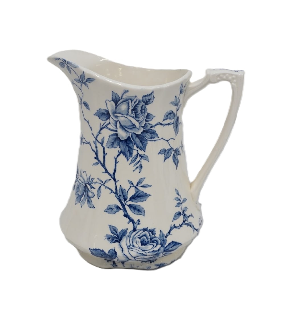 ALFRED MEAKIN BLUE AND WHITE "ROSA" PITCHER: Alfred Meakin Blue and White "Rosa" Pitcher. Measures 7.5" x 7" x 5" and weighs 1 lb 11 oz. **In house shipping available on this lot** If you win this lot, please select self arranged for in house