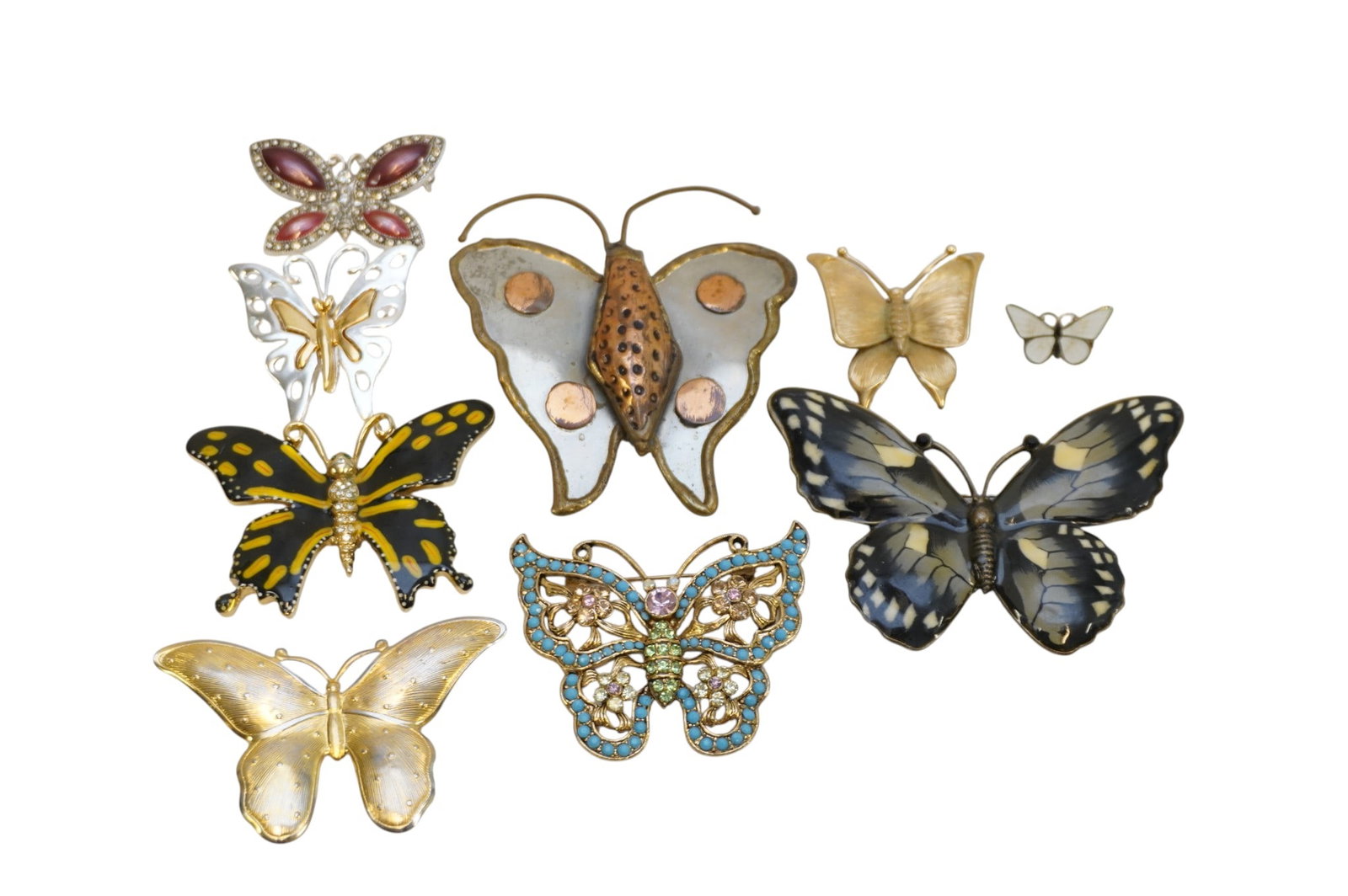 9 VINTAGE BUTTERFLY BROOCHES, ENAMEL, RHINESTONE +: 9 Vintage Butterfly Brooches.. Enamel, Rhinestones, Gold Tone, Copper. Largest enamel measures 3 1/2". Perfect summer grouping. Weight on all 6.3 oz. PROVENANCE:The Historic 1798 John Burckmeyer House