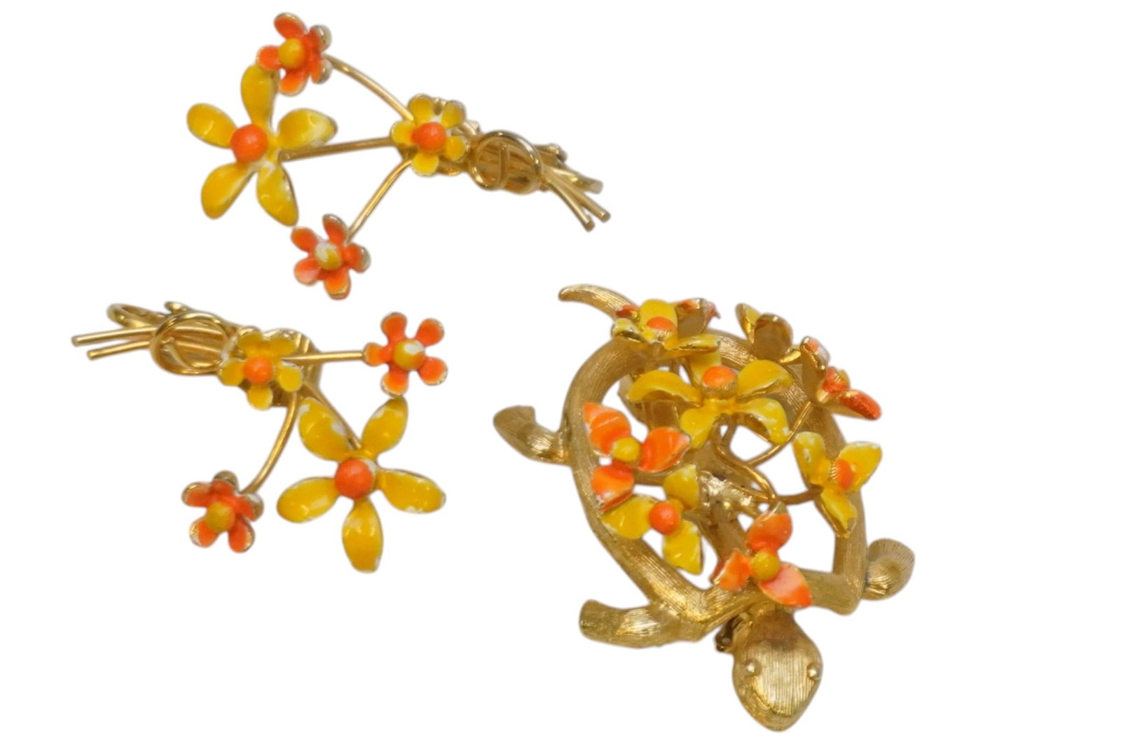 MID CENTURY RARE MARVELLA ENAMELED FLORAL TURTLE BROOCH w EARRINGS: Mid Century Enameled Floral Turtle Brooch with Matching Clip on Floral Earrings. Turtle 1 3/4". Earrings 1 1/2" . Weight 1 oz. PROVENANCE:The Historic 1798 John Burckmeyer House, 120 Wentworth Street,