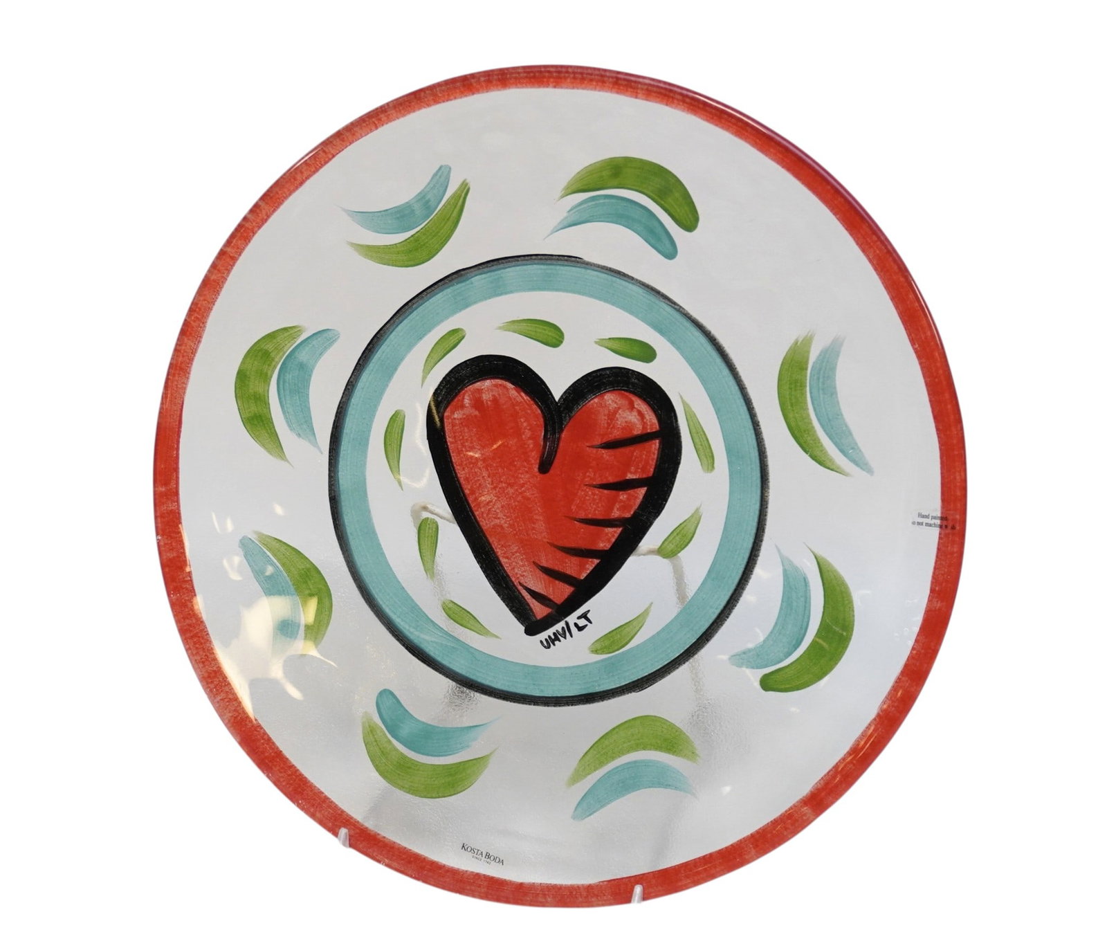 LARGE KOSTA BODA HAND PAINTED HEART ART GLASS PLATTER: Kosta Boda Heart Plate Hand Painted Ulrica Hydman Vallien Art Glass Sweden. Measures 13"x13"x1". Weight 3 lbs **In house shipping available on this lot** If you win this lot, please select self arrang