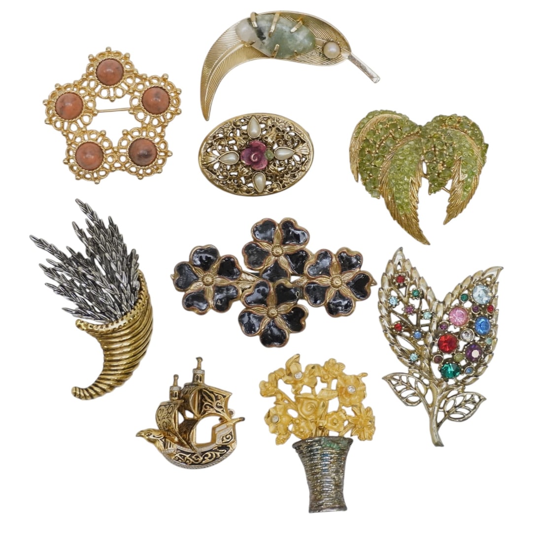 9 VINTAGE 1950-1970S COSTUME JEWELRY BROOCHES: 9 Vintage Costume Jewelry Brooches 1950s-80s. Largest 2 1/2". Weight on all 6 oz.. PROVENANCE:The Historic 1798 John Burckmeyer House, 120 Wentworth Street, Charleston SC **In house shipping available